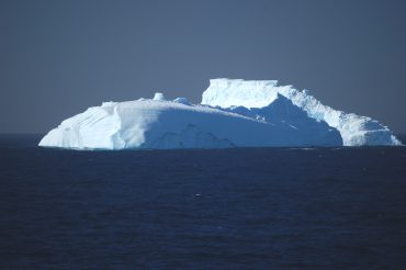 Iceberg tip in the ocean.