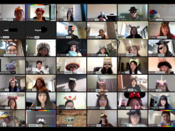 A zoom room full of students wearing funny hats