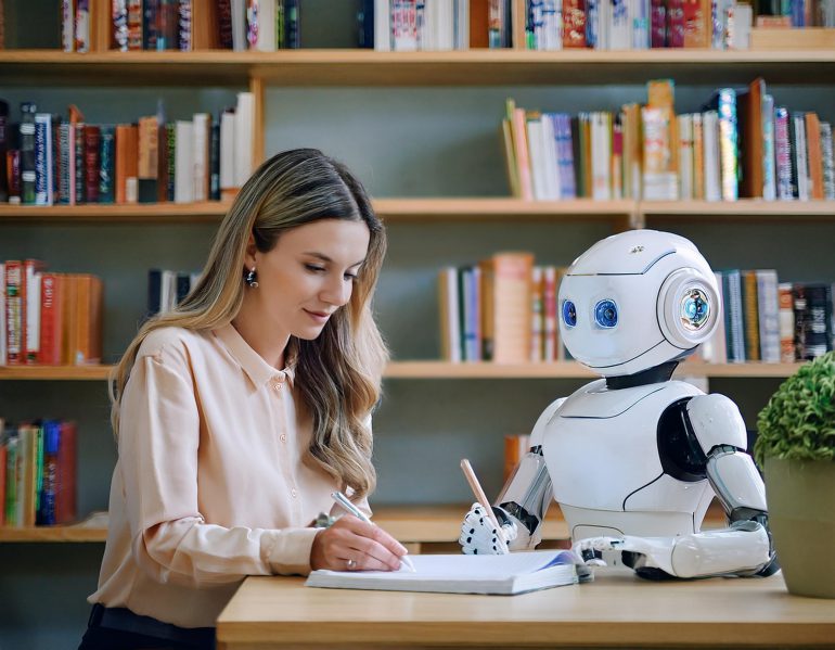 Student writing an assignment in the library, collaboratively with a robot.