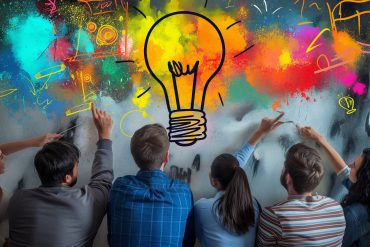 A group of people standing below a lightbulb icon and colourful scribbles symbolising brainstorming