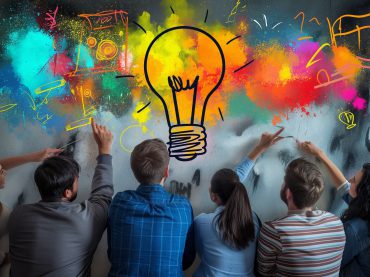 A group of people standing below a lightbulb icon and colourful scribbles symbolising brainstorming