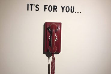 Picture of a phone with the caption, "It's for you"