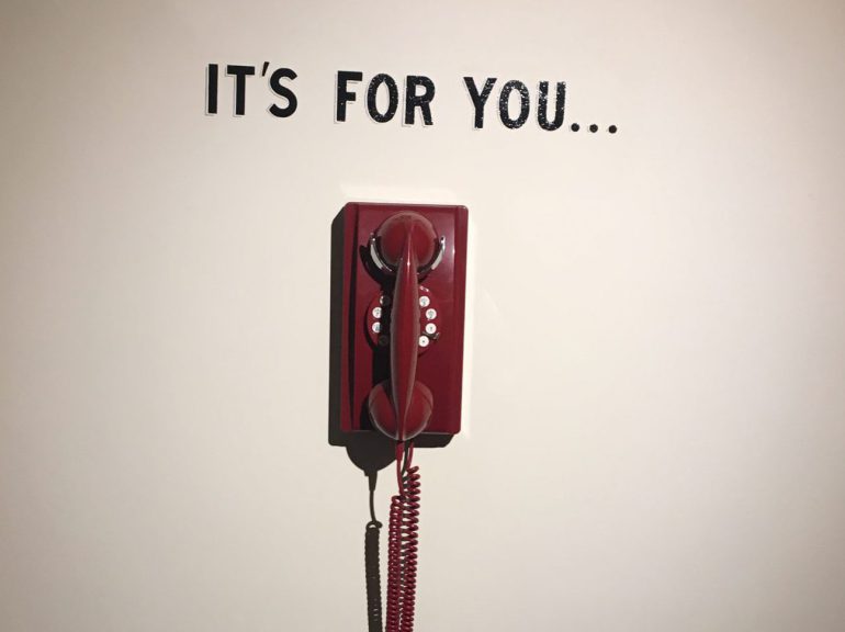 Picture of a phone with the caption, "It's for you"