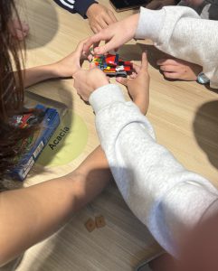 Students in QBUS3350 collaborating in their randomly assigned groups during an active learning activity