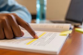Person studying with highlighted text, Nataly, 2026, Adobe Stock)